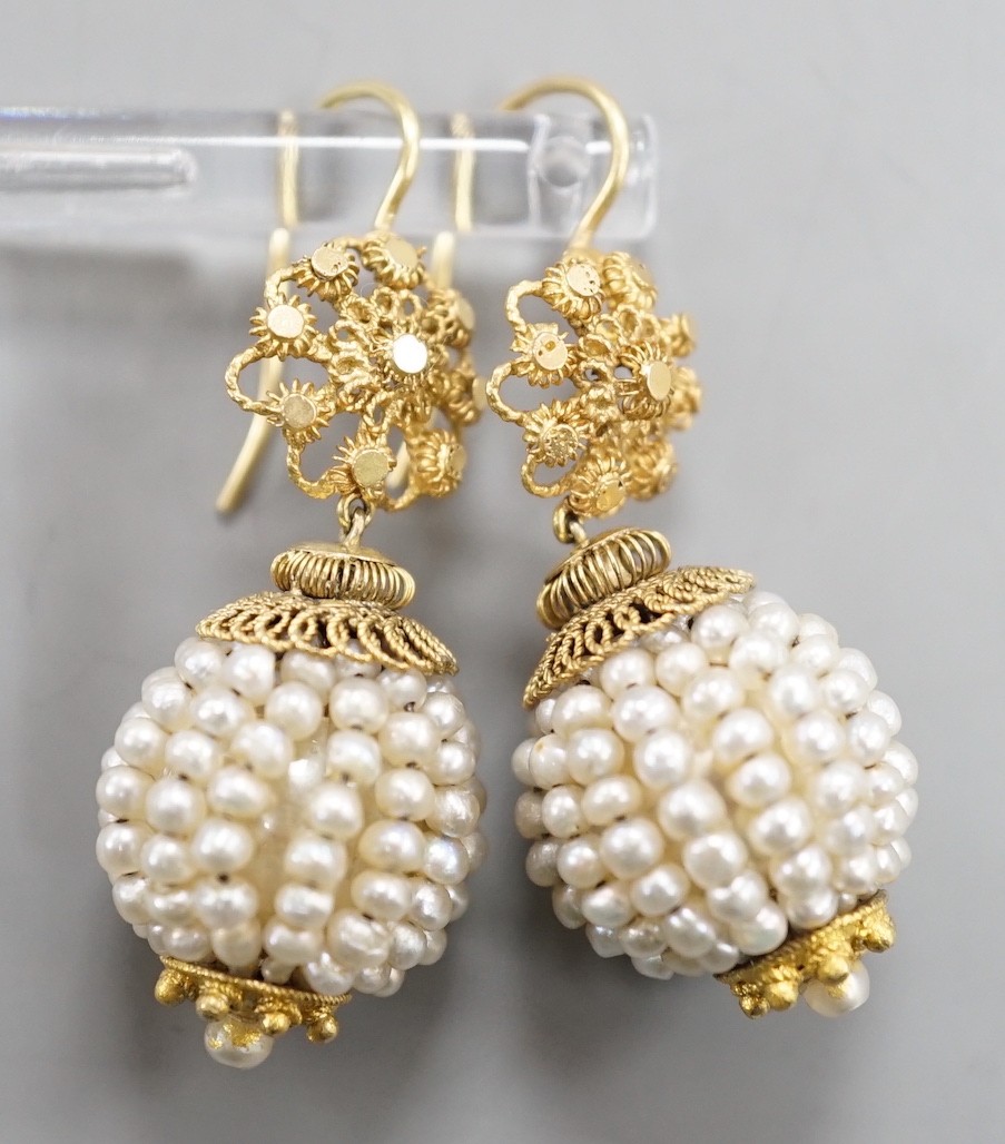 A pair of 19th century filigree yellow metal and multi seed pearl set spherical drop earrings, 34mm, gross weight 9.3 grams.